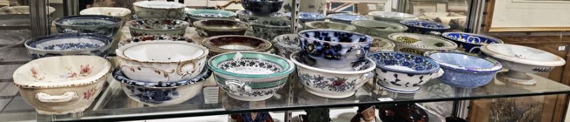 Collection of English and Continental pottery and porcelain sponge bowls and pierced liners, 19th