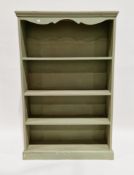 Pine green-painted bookcase with shaped frieze over three fixed shelves, on a plinth base, 149cm