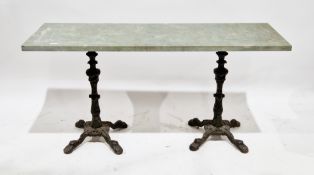 Concrete topped table, the rectangular top supported by a pair of 19th century cast iron pedestal