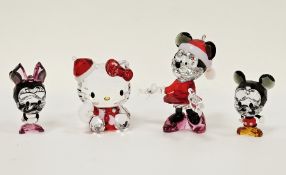 Four Swarovski crystal glass ornaments including a Disney Minnie Mouse Christmas ornament (2013