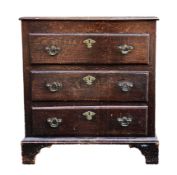 19th century oak chest of drawers with three long drawers with engraved brass escutcheons, on ogee