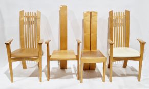 Pair of contemporary design oak and beechwood elbow chairs with square spindle backs and leatherette