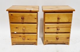 Pair of modern bedside chests of three drawers with pine knob handles, 59cm high x 45cm wide x
