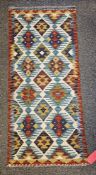 Chobi Kilim cream ground runner with two rows of four lozenges and one row of five flanked by single