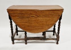 Early 20th century oak gateleg table with oval flaps, on barleytwist and block supports, 74cm high x