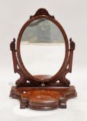 Victorian mahogany large swing mirror having an oval plate, on a shaped base with drawer, on