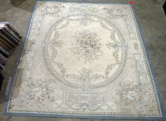 Large cream ground carpet with central oval floral medallion, floral spandrels and single