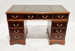 Mahogany-effect twin pedestal desk by Abbeycraft International, the rectangular top with three green