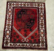 Pair of Eastern red ground prayer rugs with large elephant foot gul medallion, multiple geometric