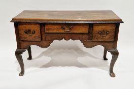 18th century oak dresser base, the rectangular top with deep thumbmoulded edge, over three frieze