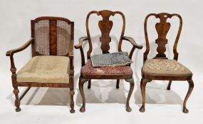 Two early 20th century walnut dining chairs in the Queen Anne manner (including one carver), the