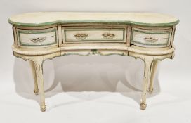 Early 20th century painted dressing table of kidney shape, the top with moulded edge over three