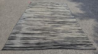 Modern cotton black ground Fabindia Collection carpet with layered fabric effect, 300cm x 200cm