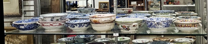 Collection of English pottery sponge dishes and pierced liners, including a Copeland Spode Italian