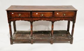 18th century oak dresser base, the rectangular top with thumbmoulded edge over three frieze