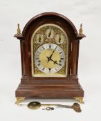 Early 20th century mahogany bracket clock, the arched case with gilt metal finials, quarter