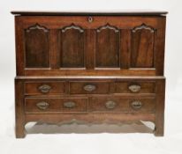 18th century oak mule chest, the hinged lid with thumbmould edge, the front with four moulded arched