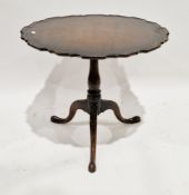George III mahogany tilt top supper table, the circular top with moulded pie-crust edge, on a turned