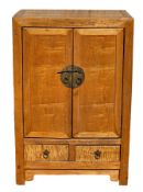 Chinese blonde wood cabinet having pair panel doors with brass mounts, drop ring handles and locking