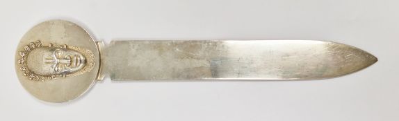 French Christofle silver plated paper knife, the terminal with raised decoration of an African