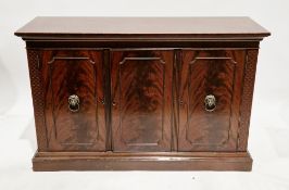 Mahogany sideboard in the George III manner comprising three panelled cockbeaded cupboard doors