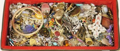 Two wicker sewing baskets containing a large quantity of costume jewellery including brooches,