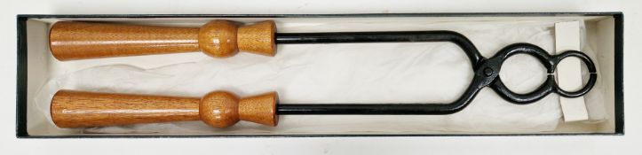 Boxed set of Port tongs with turned wooden handles, 49cm long