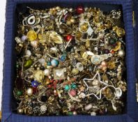 Two wicker sewing baskets containing a large quantity of costume jewellery mainly earrings, pendants