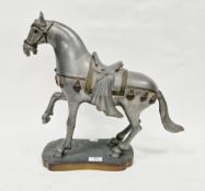 Contemporary Hong Kong pewter and brass model of a Tang-style horse, wearing a saddle and bridle