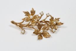 9ct yellow gold brooch in the Victorian style, in the form of a floral spray set with seed pearls,