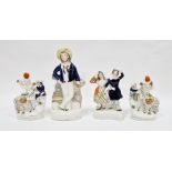 Pair of Victorian pottery zebra spill vases, late 19th century, modelled with a highlander girl