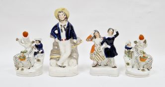 Pair of Victorian pottery zebra spill vases, late 19th century, modelled with a highlander girl