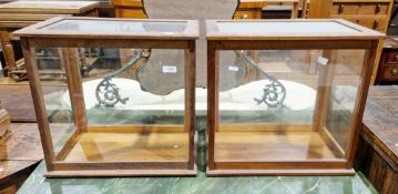 Pair of early 20th century mahogany balance scale cases with glazed panels to five sides and back