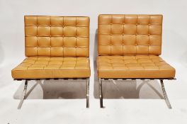 In the manner of Ludwig Mies van de Rohe a pair of Barcelona-type lounge chairs, having tan brown