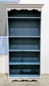 Modern pine bookcase painted in two shades of blue, having two adjustable and two fixed shelves,