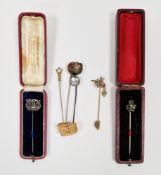 Six late 19th / early 20th century stickpins including a yellow metal pin having dragonfly finial