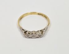 18ct yellow gold and diamond ring, comprising a row of three illusion-set round diamonds on a
