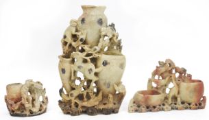 Three 20th century Chinese carved soapstone vases or brush pots, the largest carved with three
