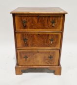 19th century George III revival walnut and crossbanded bachelor's chest of three long drawers,