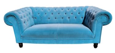 Blue dralon two-seater Chesterfield settee, button upholstered and on turned supports, approximately