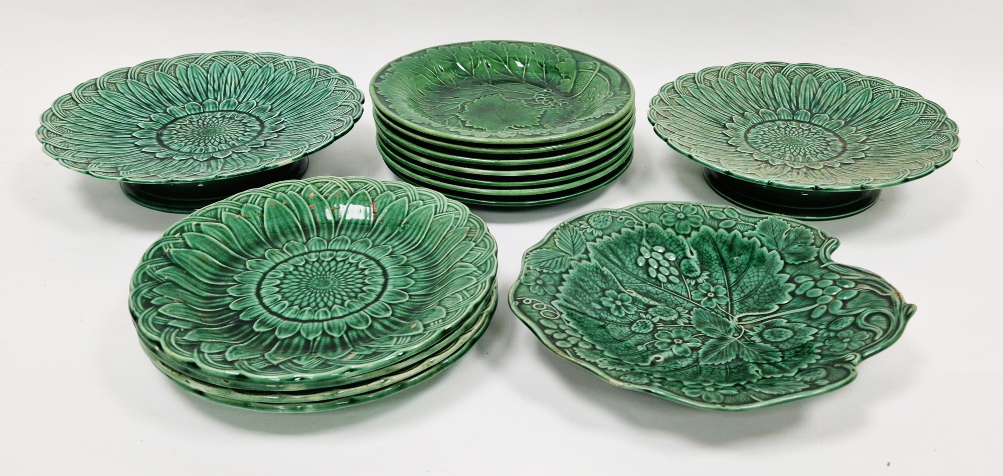 Group of English green glazed majolica leaf moulded dishes, late 19th century, one impressed
