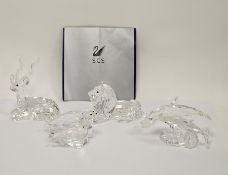 Four Swarovski crystal animals including lion 185410 (1995 annual edition), dolphins 'Lead Me'