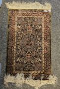 Persian style silk green ground rug with central floral motif on floral and stylised bird pattern