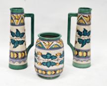 Pair of Wood's pottery Arabesque pattern jugs by Charlotte Rhead, of tall tapering conical form with