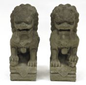 Pair of 20th century Chinese grey stone buddhist lions, each modelled in the Archaic style with