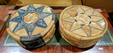 Two mid-20th century Moroccan leather floor pouffes, each of circular form with stitched and