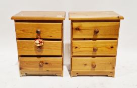 Pair of modern bedside chests of three drawers with pine knob handles, 59cm high x 45cm wide x