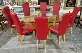 Tom Schneider Wave dining table, the oval glass top on an S-scroll pale oak plinth base, 77cm high x