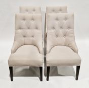 Set of four contemporary dining chairs with chrome-effect studded and button-back cream fabric