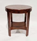 Chinese-style hardwood circular side table with blind fretwork carving to apron and legs, the